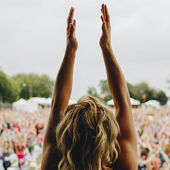Holmes Place | Woman doing yoga in front of crowd